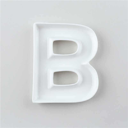 white ceramic letter dishes set