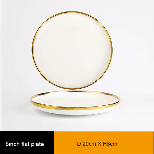 white ceramic dinner plate with gold rim